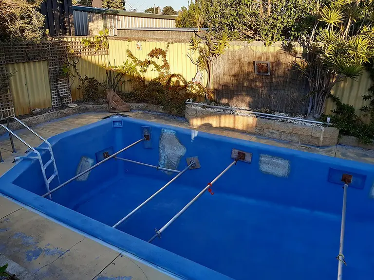 Example of a fibreglass pool refurbishment in Perth, showing surface patches and temporary bracing